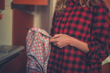 Young woman doing the dishes