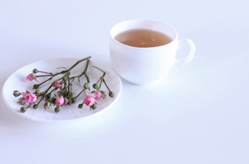 A hot cup of coffee on white wooden background. Seasonal, morning coffee, Sunday relax and still life concept. Free place for text.