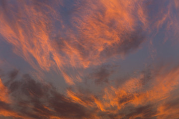 Beautiful, heavy clouded blue sunset sky background.