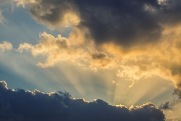 Beautiful, heavy clouded blue sunset sky background.