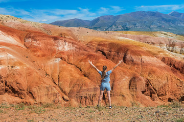 Woman in valley of Mars landscapes in the Altai Mountains, Kyzyl Chin, Siberia, Russia