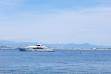 Fototapeta na wymiar Yachts cruising on water near Cannes