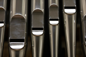 Shiny large metal organ pipes