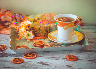 cup of tea with dried orange slices