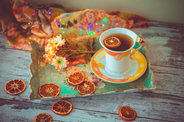 Obraz na płótnie Canvas cup of tea with dried orange slices