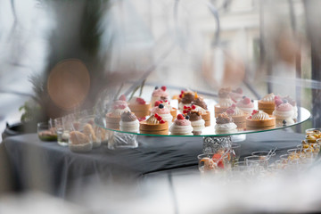 Small dessert bites on a glass surface