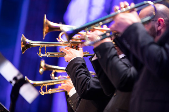 A big band trumpet section during a live performance Stock Photo
