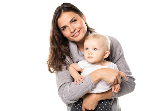 A mother holdng his baby on studio white background