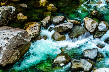 Naklejka na ściany i meble The turquoise waters Coquihalla River as it flows through the deep Coquihalla Canyon and past the Othello Tunnels of the old Kettle Valley Railway near the town of Hope, British Columbia, Canada 