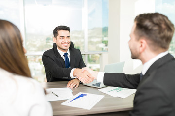 Adviser Sealing A Deal With Clients