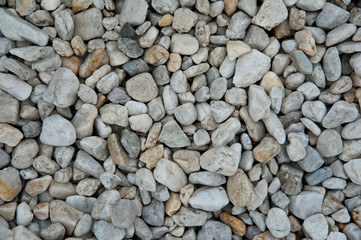 Stone pebbles white and gray gravel texture background for decoration.