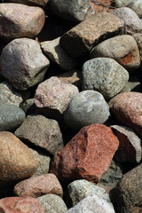 Lots of stones, big and small, lying on the floor makes for a beautiful stones background which can be used for wallpaper or other needed content.