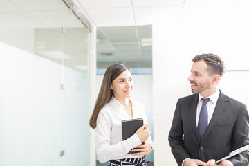 Sales Executives Discussing At Workplace