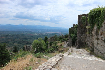 Fototapeta na wymiar View to the ruins of abandoned ancient town Mystras and valley with the city Sparta, Peloponnese, Greece