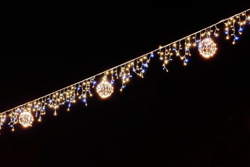 Luminous Christmas gerland on a dark background. Copy space. Christmas, New Year's background....