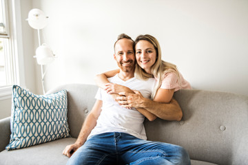 Young couple on the sofa relaxing at home