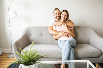 Young couple on the sofa relaxing at home