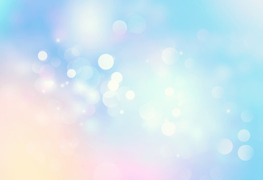 Light blue blurred abstract bokeh background.