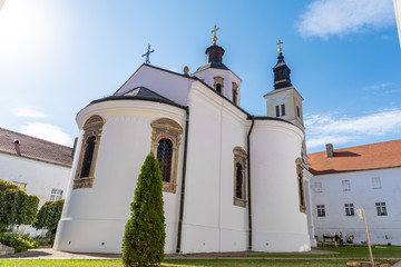 a beautiful old Orthodox monastery located in a large park