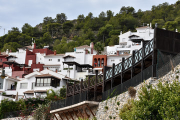 Fototapeta na wymiar urbanizacion tipica andaluza con mirador de forja de hierro construida sobre muro de piedra