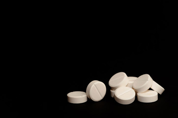 A lot of tablets on black background