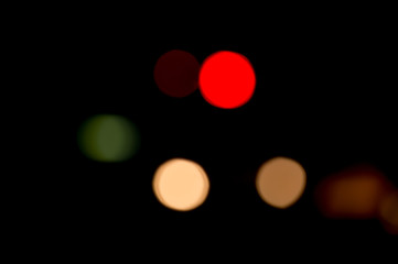 Colorful defocused bokeh lights background. Festive background with natural bokeh. Abstract blur background.