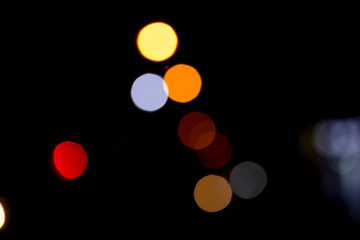 Colorful defocused bokeh lights background. Festive background with natural bokeh. Abstract blur background.