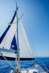 Sailing. Ship yachts with white sails in the open Sea.