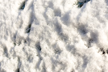 parked car covered with snow during snowing in winter time