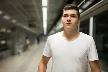 Portrait of male passenger on underground platform