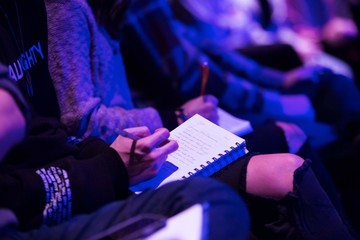 Young Man Taking Notes