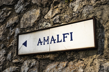 close-up of an ancient road sign of Ravello, indicating the direction to Amalfi. In the province of Salerno, on the Amalfi coast.