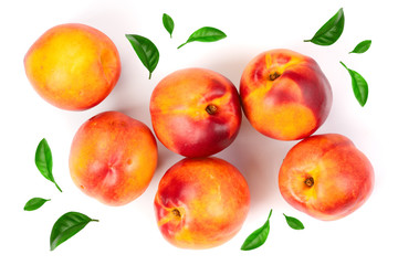 ripe nectarine with leaves isolated on white background. Top view. Flat lay pattern