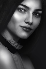 Portrait of a beautiful young woman. Female face close up. Black and white photo