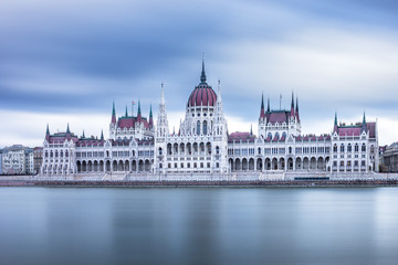 Front view to the Hungarian Parliament on a cloudy day in Budapest, Hungary