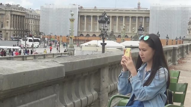 Girl taking pictures timelapse, Paris, France
