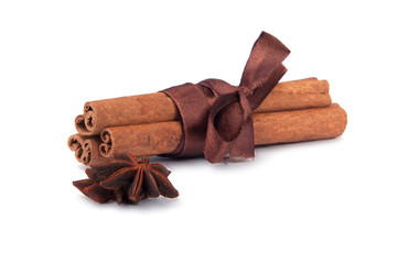 Cinnamon sticks with ribbon isolated on the white