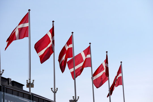 Denmark flag on a mat in the wind and blue sky
