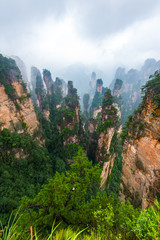 Sandstone pillars and mountains seen from a viewing platform near the Kongzhong Tianyuan garden. Zhangjiajie, Hunan, China.