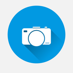 Vector digital camera icon on blue background. Flat image Retro camera with long shadow. Layers grouped for easy editing illustration. For your design.