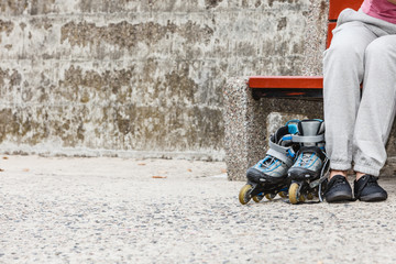 Woman with roller skates outdoor.