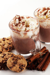 Hot chocolate cocoa with whipped cream on table.