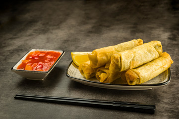 Spring rolls, chopsticks and sauce