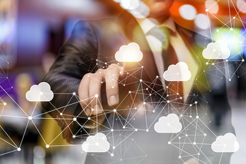 A businessman is operating with the cloud network diagram using the new digital technology.