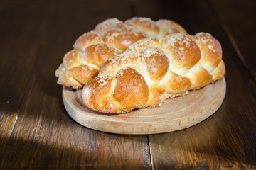 Challah bread on wooden table