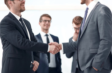 successful business partners shaking hands