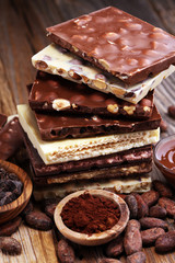 Chocolate bars on table with chocolate tower.