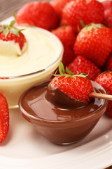 Fondue with Melting chocolate or melted chocolate and strawberry.