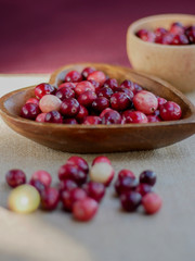 wild cranberries in a wooden bowl