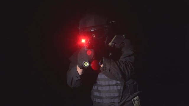 Automatic with laser sight. The soldier holds a laser sight on the target. 4k